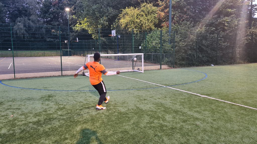 young man playing football