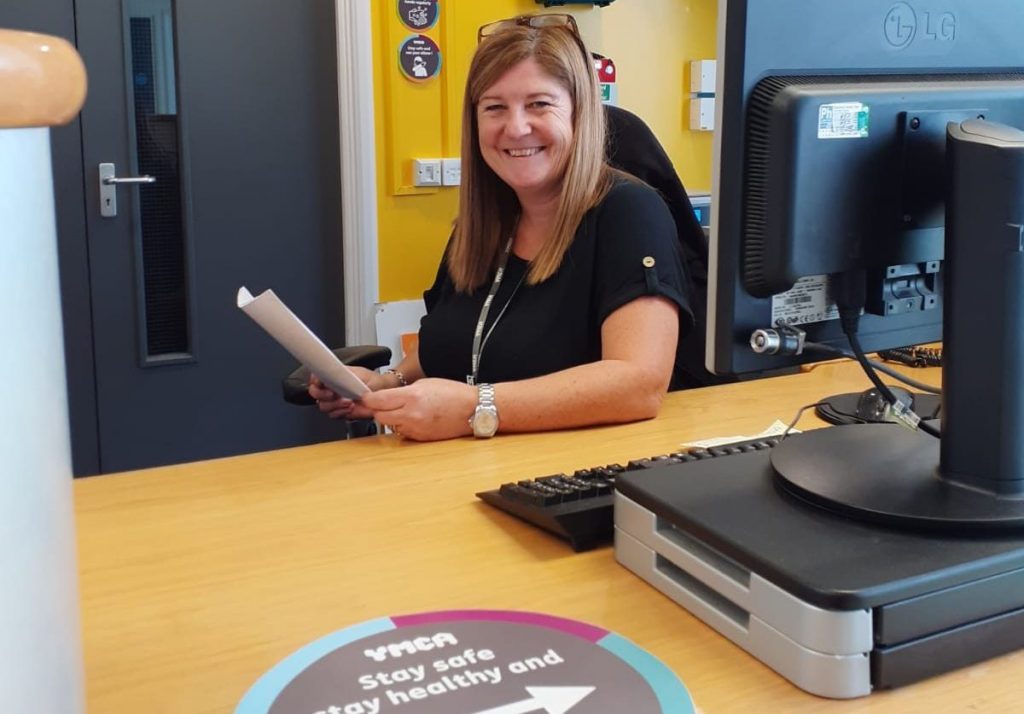 woman sitting at the front desk